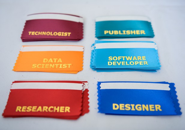 Six coloured name badge ribbons with job roles printed on
