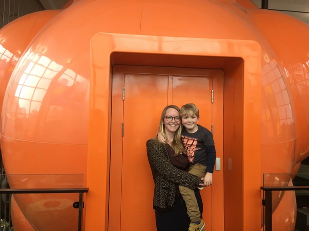 A mother and child outside of a centre for scientific outreach 