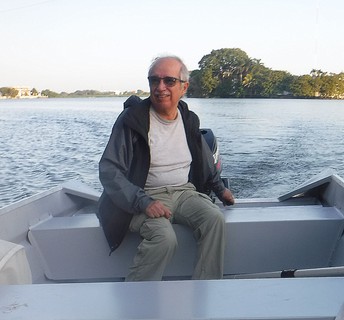 Manuel Elías-Gutiérrez piloting a motorboat on a Mexican waterway