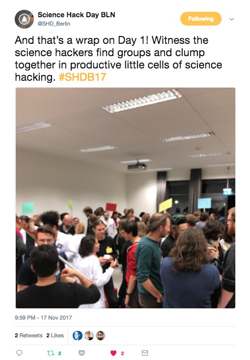 Embedded tweet about event with photo of people assembled in room