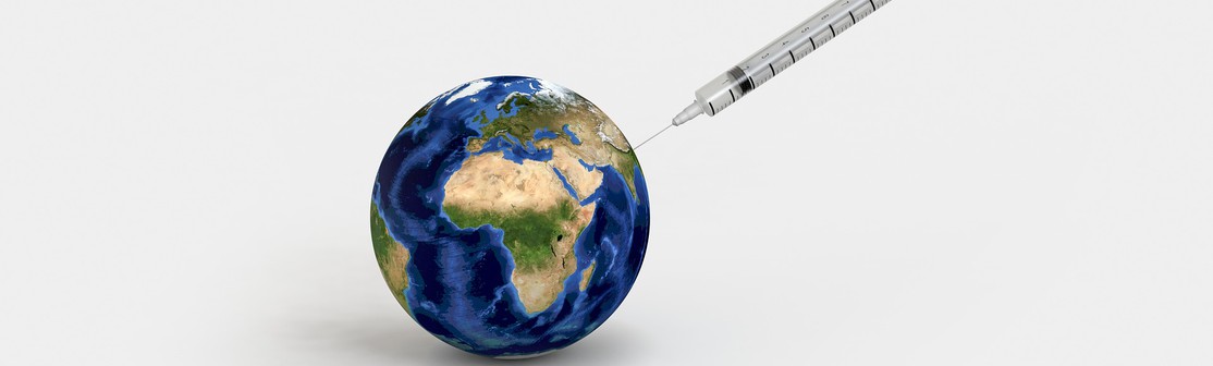 A syringe injecting a clear liquid into the Earth