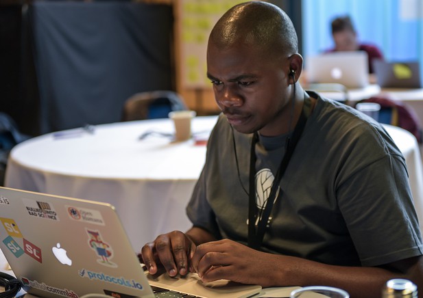 A person works on a laptop